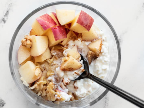 Cottage Cheese Bowl with Sliced Apples, Granola, and Honey Drizzle